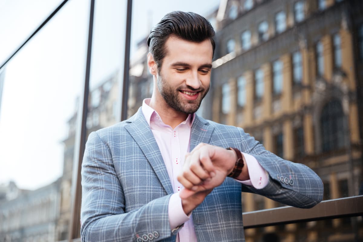 handsome-young-man-checking-time-his-wrist-watch
